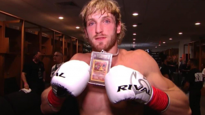 Logan Paul Wears Rare Charizard Card As Necklace To Floyd Mayweather Fight